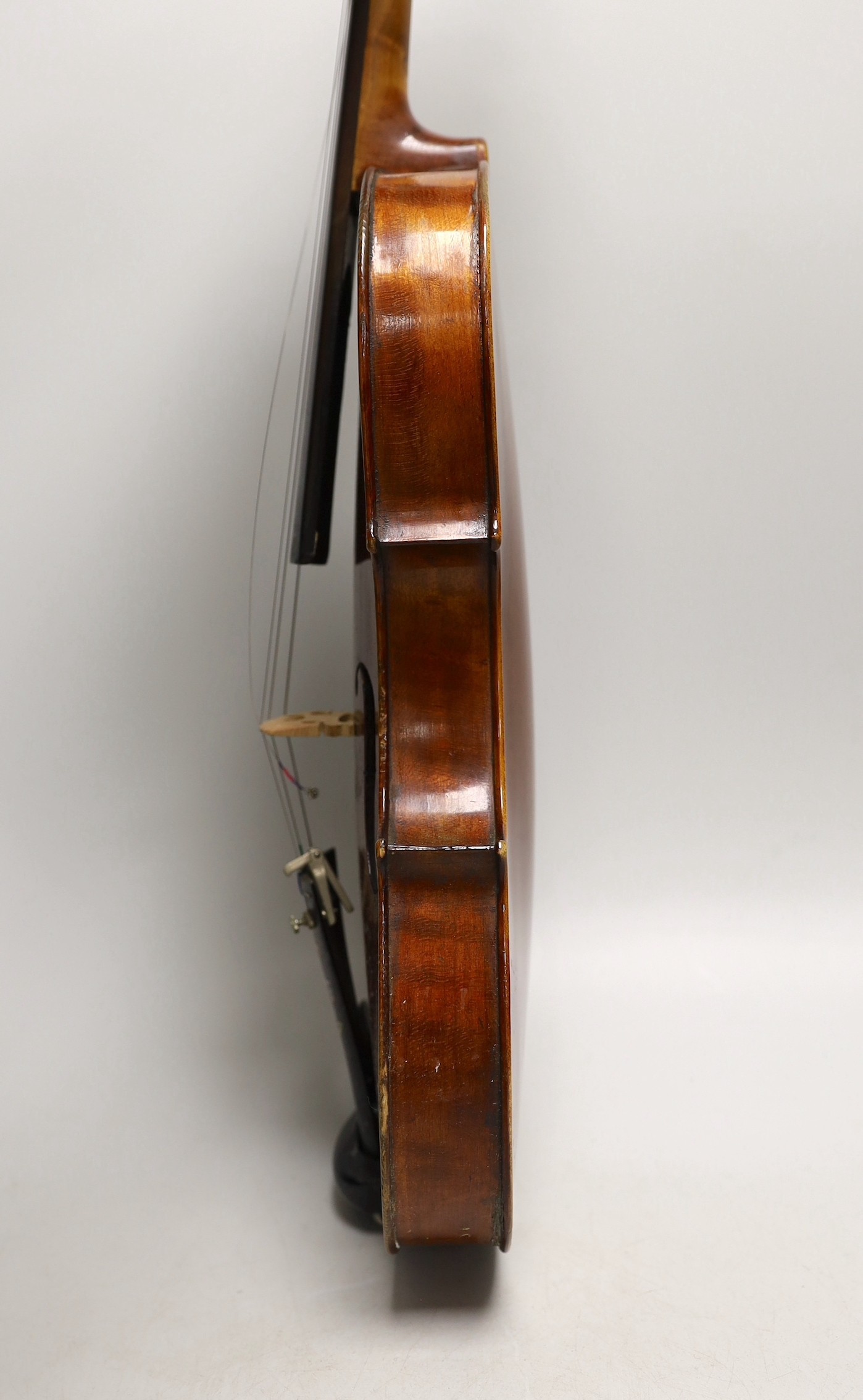 A French single back violin, interior label reads ‘Médio Fino’, back measures 35.5cm excl button. With case and bow